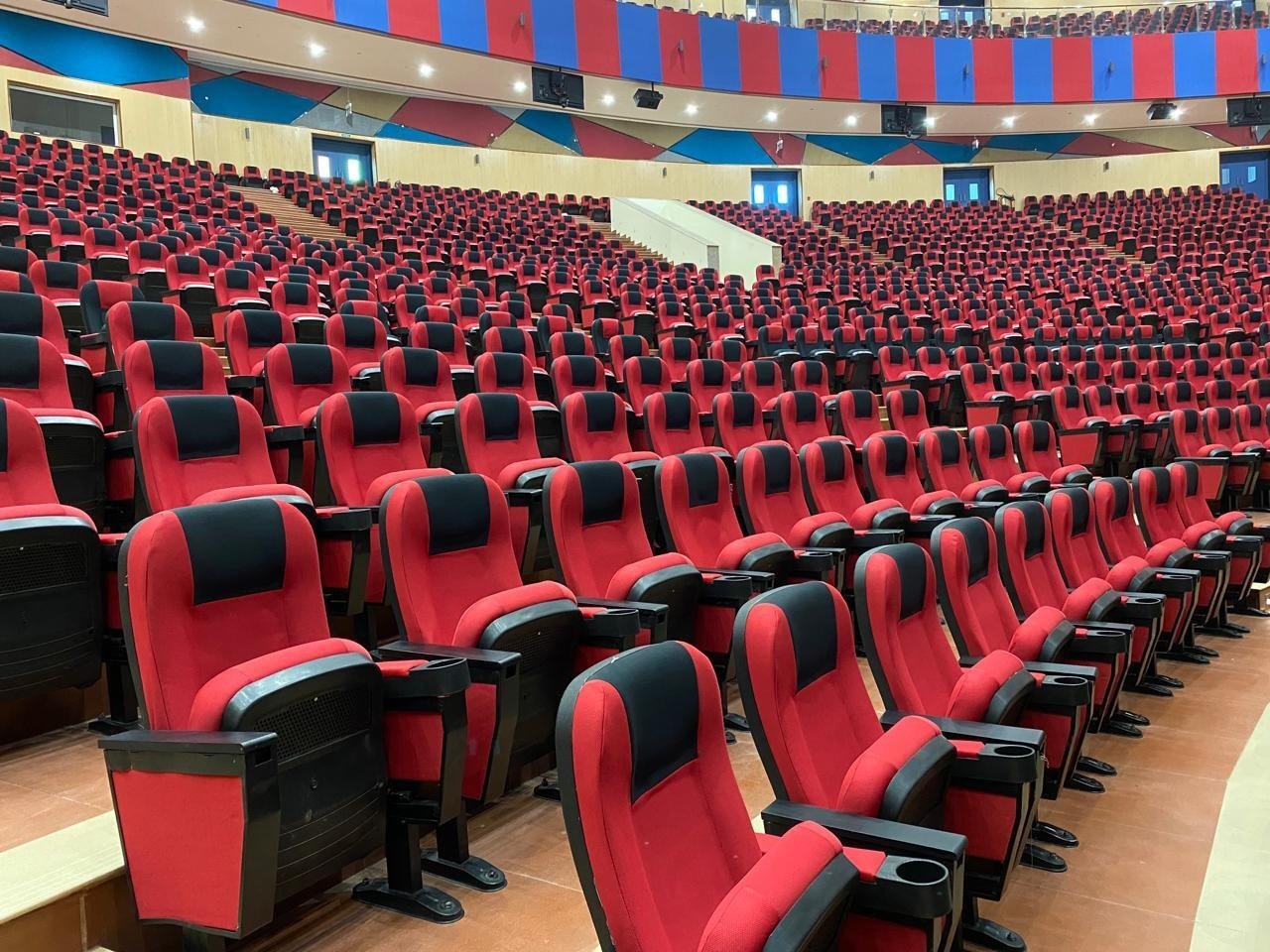 Close-up view of Brandwave Furniture auto tip-up auditorium chair mechanism